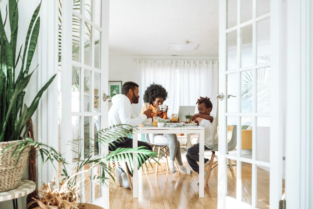 people sitting on chairs in front of table